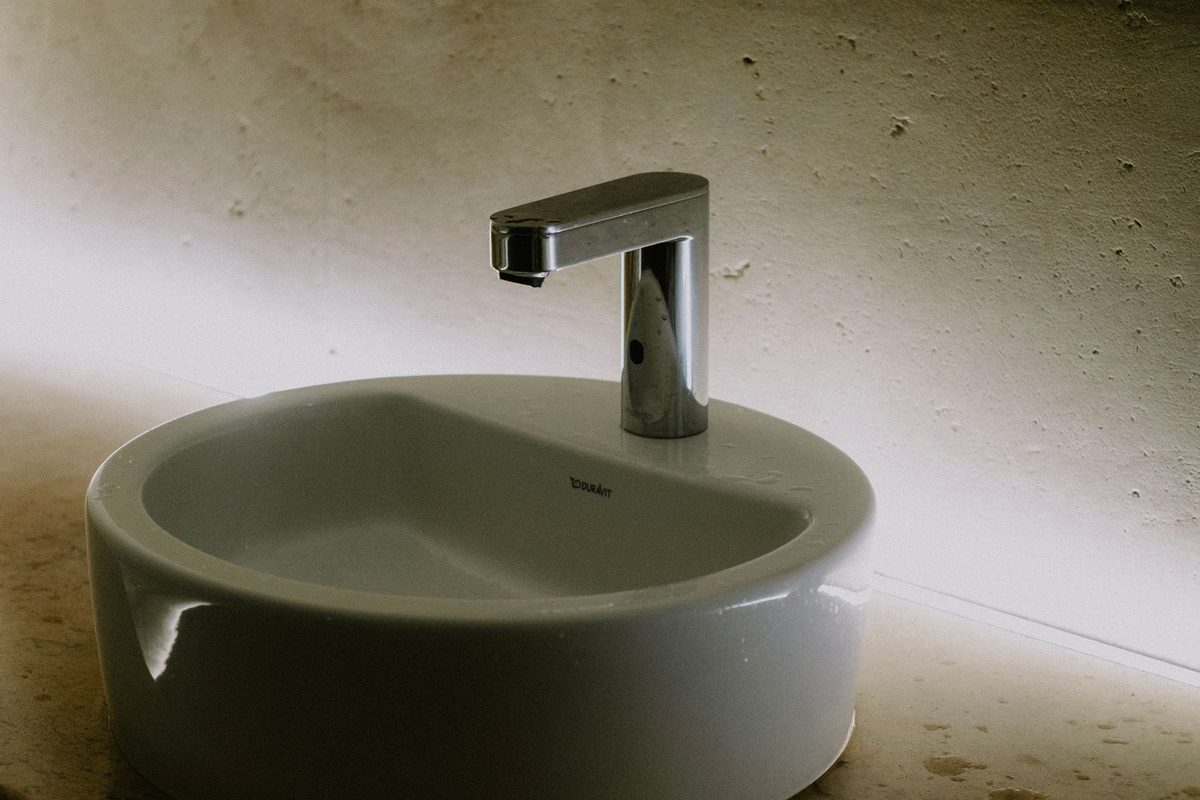 Basin with a slim mixer tap seen from above